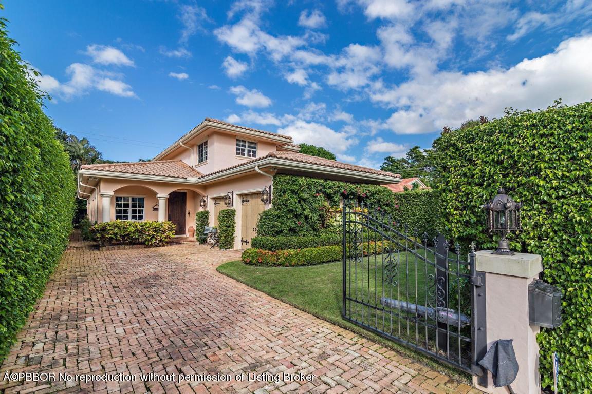 309 Valencia Road West Palm Beach, FL 33401 - Photo 23 of 24 a front view of house with yard and green space