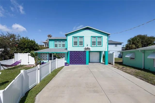 a front view of a house with yard