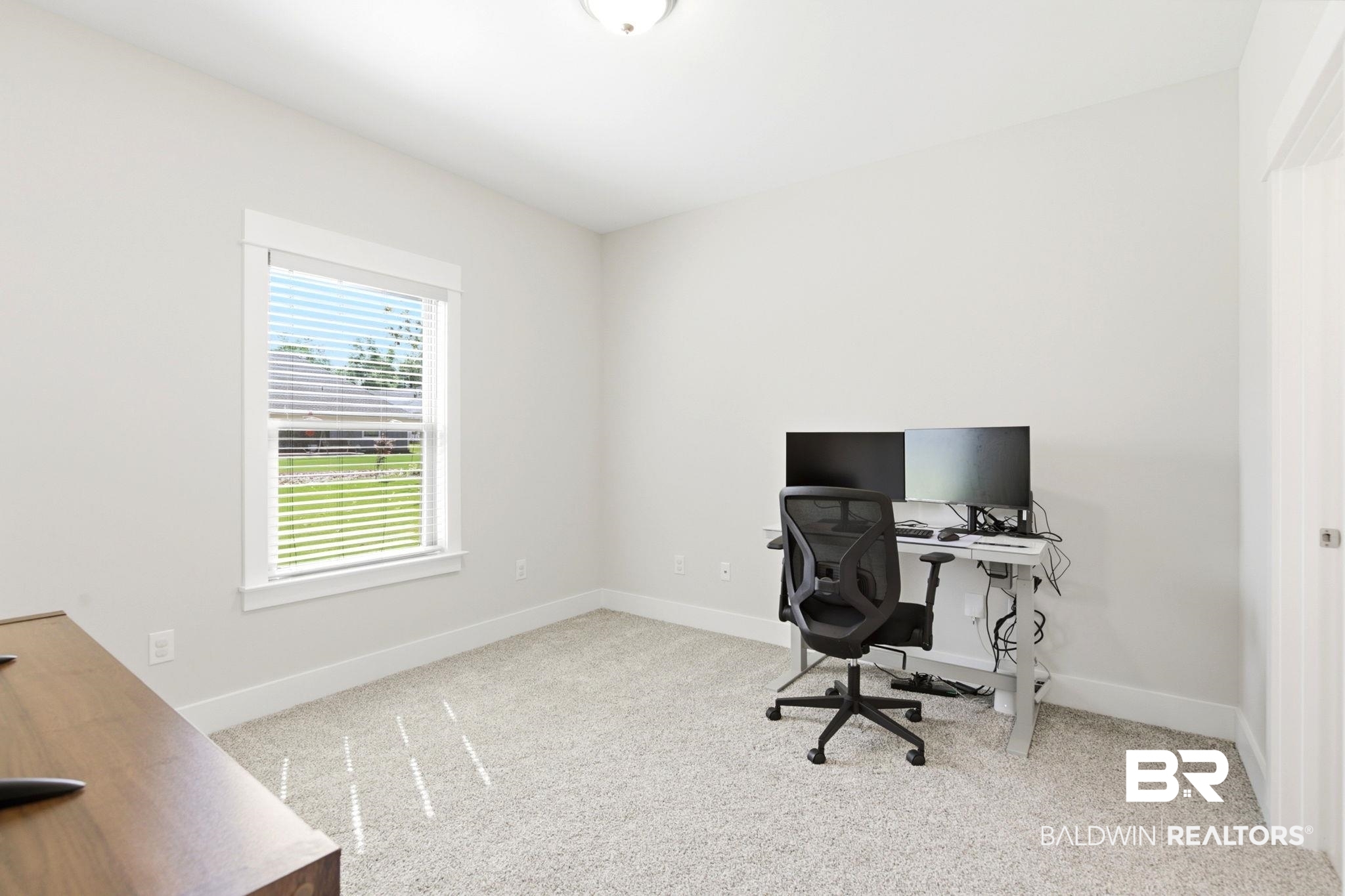 12132 Exbury Way Daphne, AL 36527 - Photo 20 of 47 Office area featuring light colored carpet and baseboards