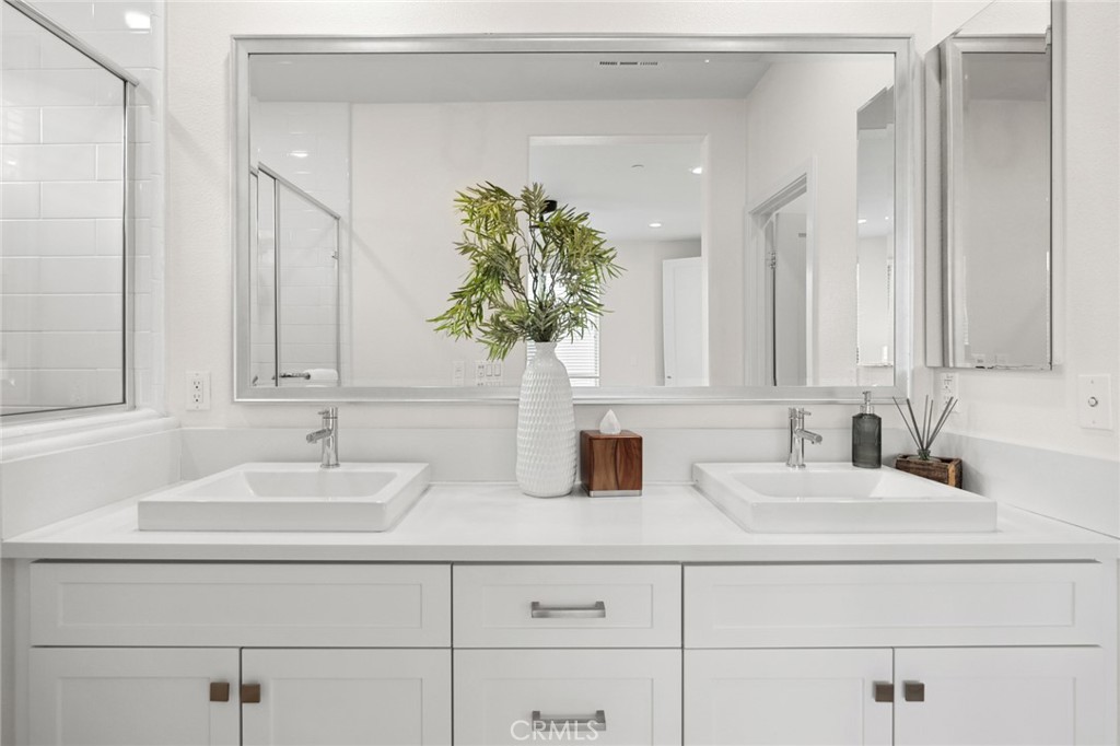 134 Stellar Irvine, CA 92618 - Photo 19 of 49 a bathroom with sink and mirror