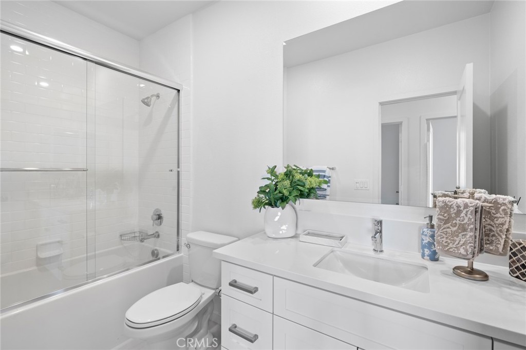 134 Stellar Irvine, CA 92618 - Photo 21 of 49 a bathroom with a granite countertop sink a toilet and shower