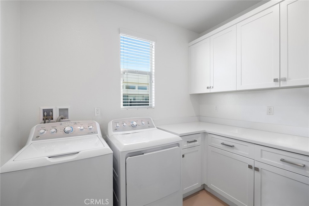 134 Stellar Irvine, CA 92618 - Photo 23 of 49 a utility room with dryer and washer