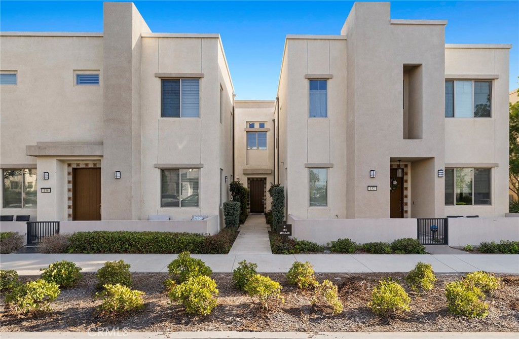134 Stellar Irvine, CA 92618 - Photo 25 of 49 a front view of a house with a yard