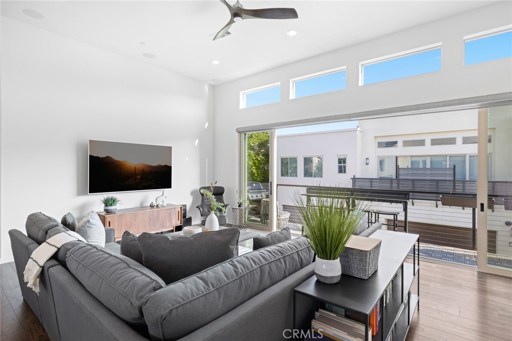 134 Stellar Irvine, CA 92618 - Photo 5 of 49 a living room with furniture and a flat screen tv