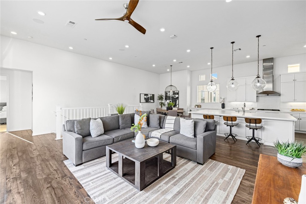 134 Stellar Irvine, CA 92618 - Photo 8 of 49 a living room with lots of furniture and a large window