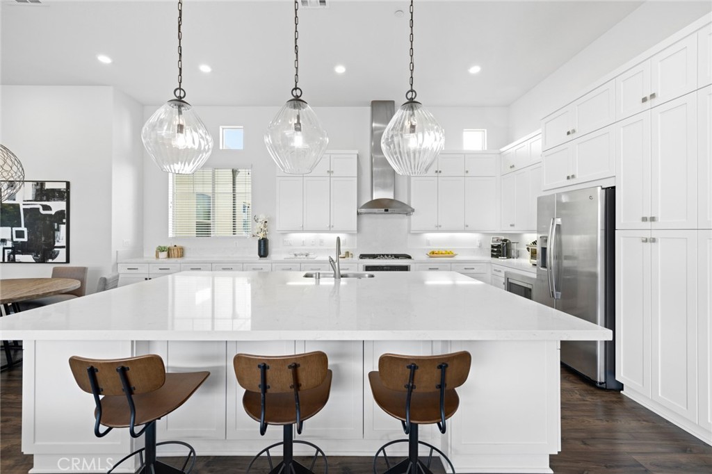 134 Stellar Irvine, CA 92618 - Photo 10 of 49 a large kitchen with a table and chairs