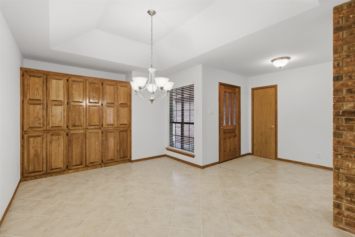 3311 Squirrel Hollow Austin, TX 78748 - Photo 11 of 40 Dining area with gambrel ceiling and custom built-ins