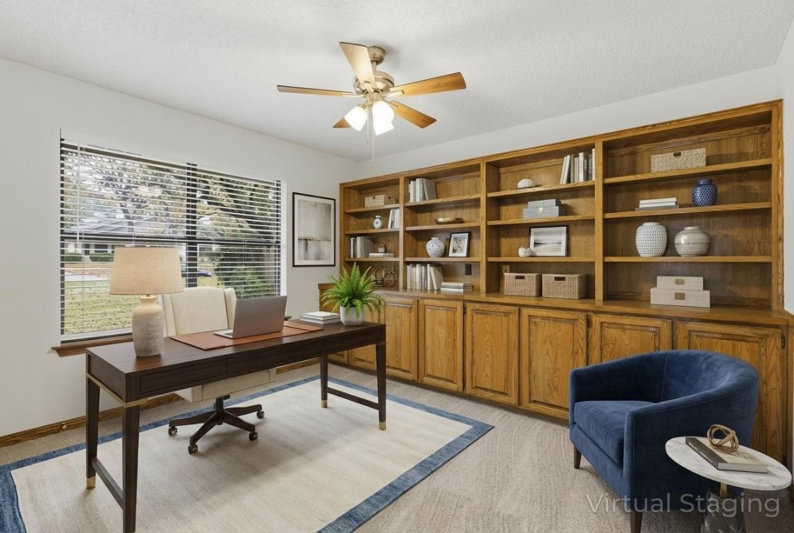 3311 Squirrel Hollow Austin, TX 78748 - Photo 25 of 40 This 4th bedroom features a wall of built-ins. It functions as either a bedroom, home office, or play room (virtually staged).