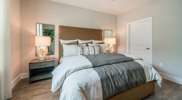 a bedroom with a bed and window