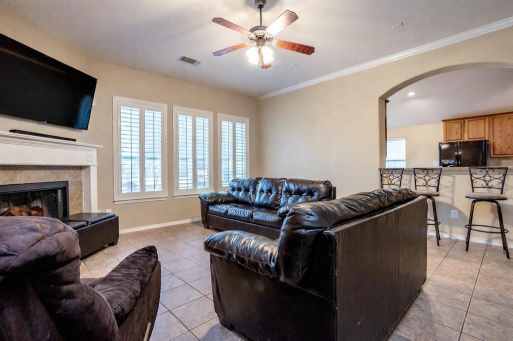 5886 Cliff Ridge Drive Dallas, TX 75249 - Photo 5 of 15 a living room with furniture and a flat screen tv