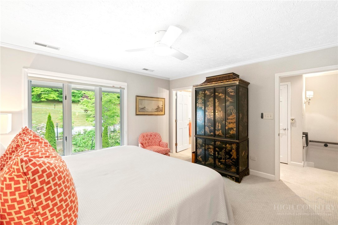 361 The Lakes, Unit C9 Boone, NC 28607 - Photo 16 of 47 a bedroom with a large bed and a window