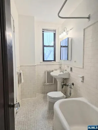 a bathroom with a sink and a bathtub