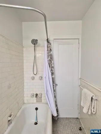 a bathroom with a shower and a shower