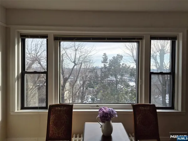 a view of a room with furniture and a window