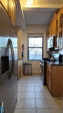 a kitchen with stainless steel appliances a refrigerator and a sink