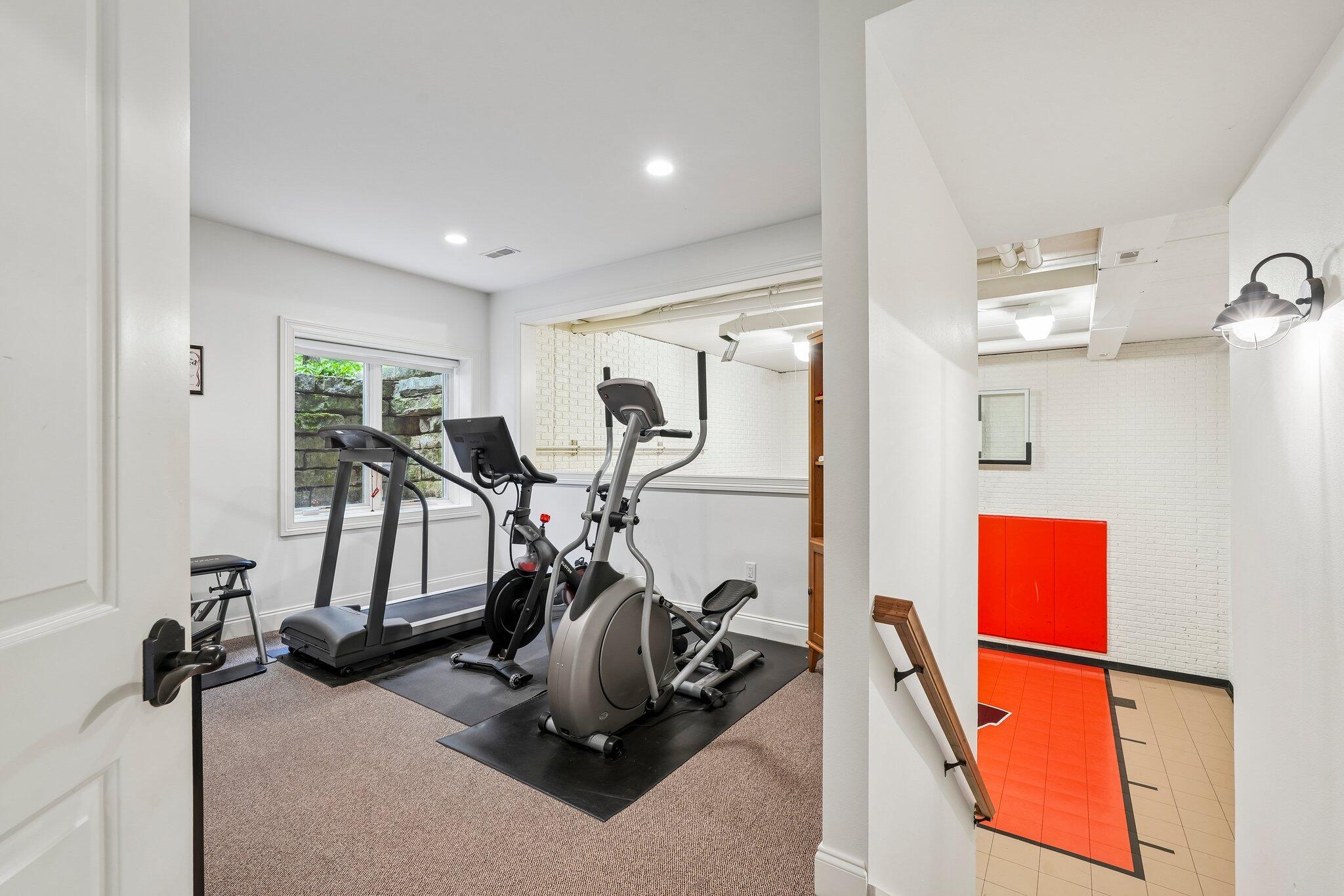W343N6293 South Bayview Road Oconomowoc, WI 53066 - Photo 86 of 104 Excercise room overlooking sports court