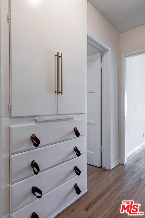 223 6th Avenue Venice, CA 90291 - Photo 13 of 39 a view of a closet with wooden floor