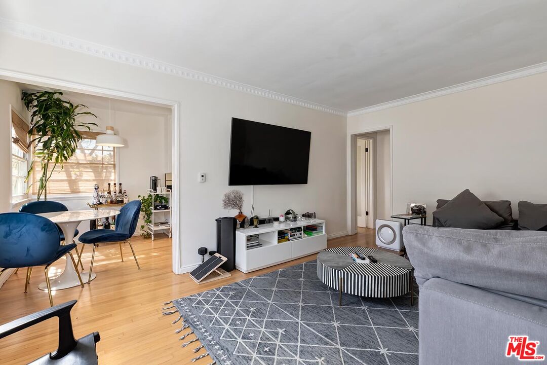 223 6th Avenue Venice, CA 90291 - Photo 17 of 39 a living room with furniture and a flat screen tv