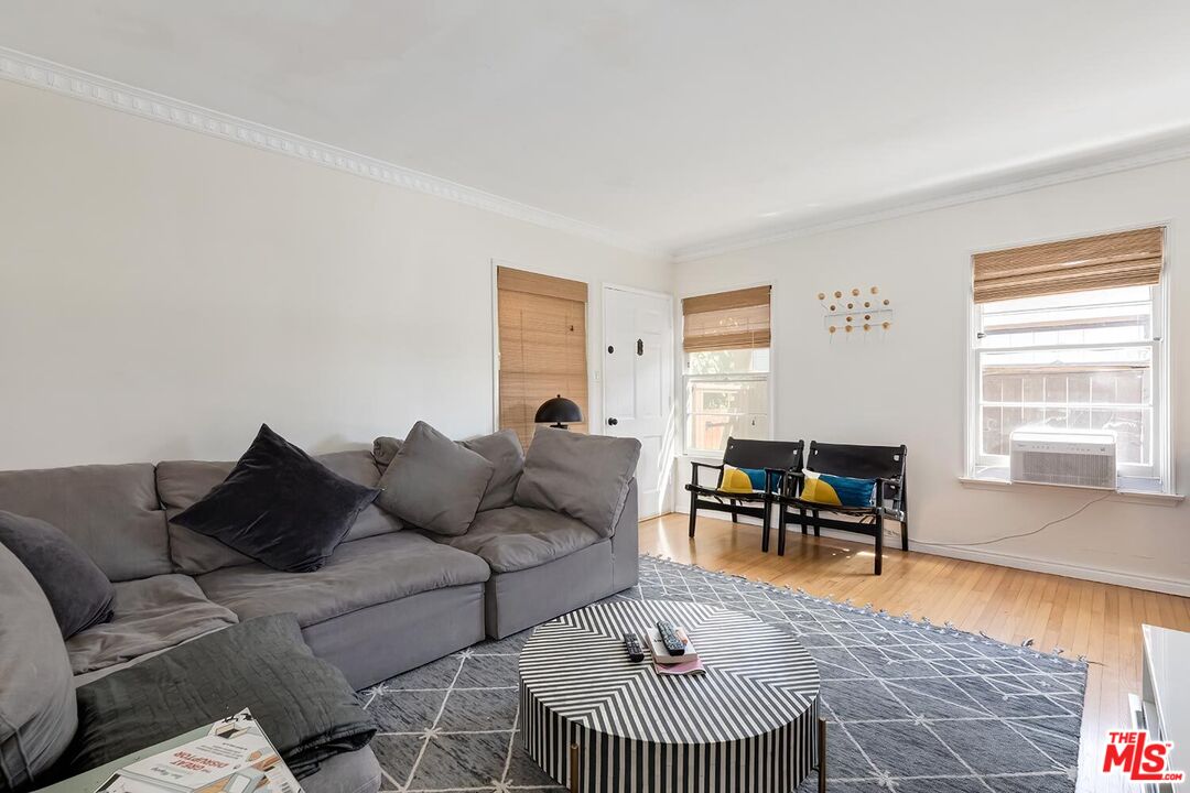 223 6th Avenue Venice, CA 90291 - Photo 19 of 39 a living room with furniture and a window