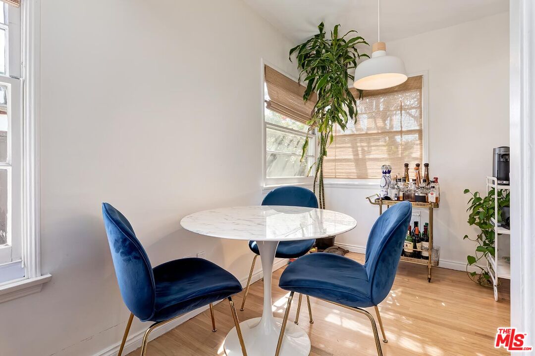 223 6th Avenue Venice, CA 90291 - Photo 20 of 39 a view of a dining room with furniture and a potted plant