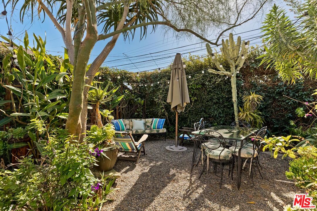 223 6th Avenue Venice, CA 90291 - Photo 29 of 39 a view of a patio with table and chairs and potted plants