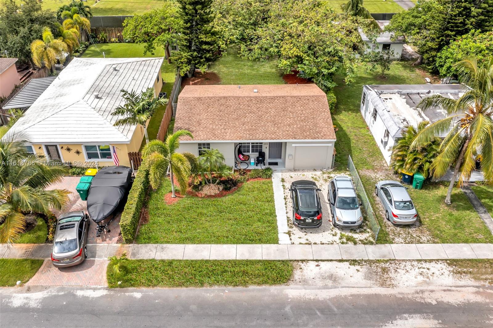 243 Southwest 9th Street Dania Beach, FL 33004 - Photo 2 of 31 an aerial view of a house with garden space and street view