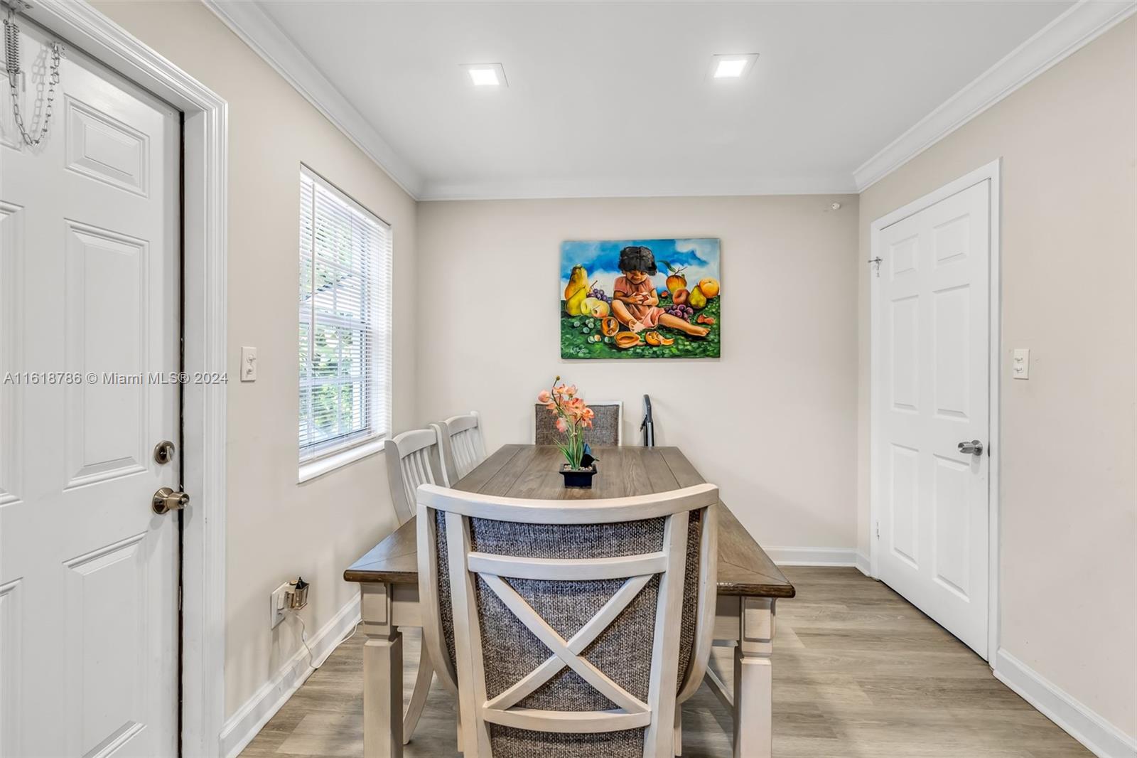 243 Southwest 9th Street Dania Beach, FL 33004 - Photo 21 of 31 a dining room with furniture and wooden floor