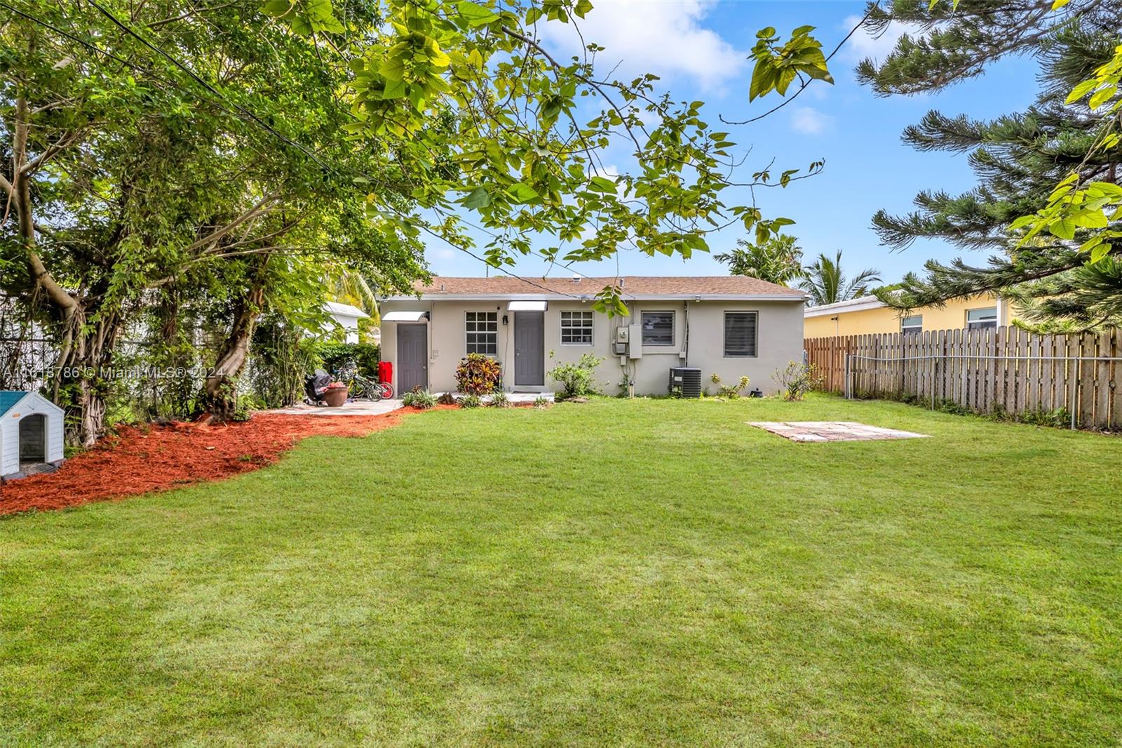 243 Southwest 9th Street Dania Beach, FL 33004 - Photo 30 of 31 a view of house with yard and outdoor seating