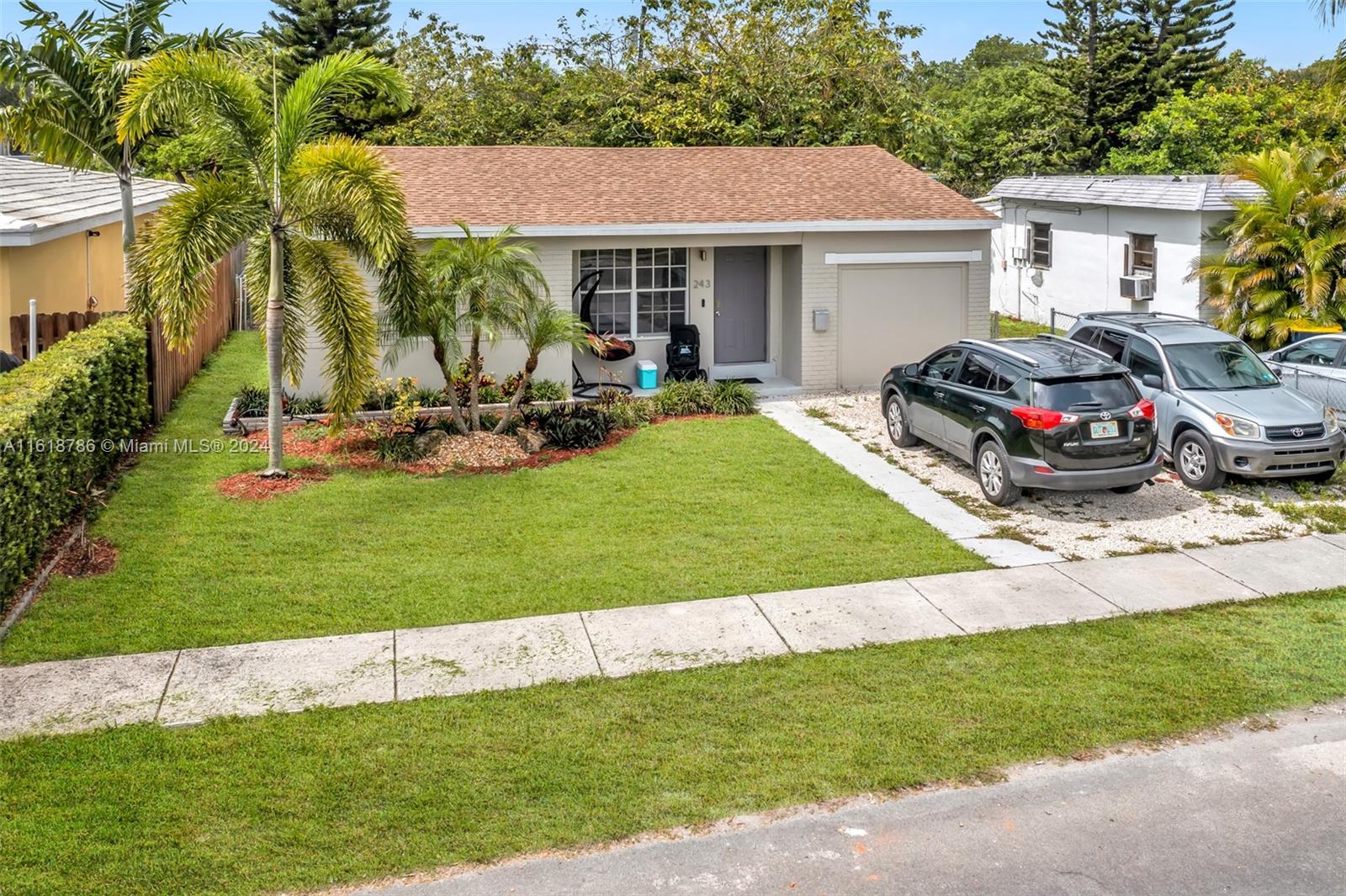243 Southwest 9th Street Dania Beach, FL 33004 - Photo 5 of 31 a view of a house with backyard and sitting area