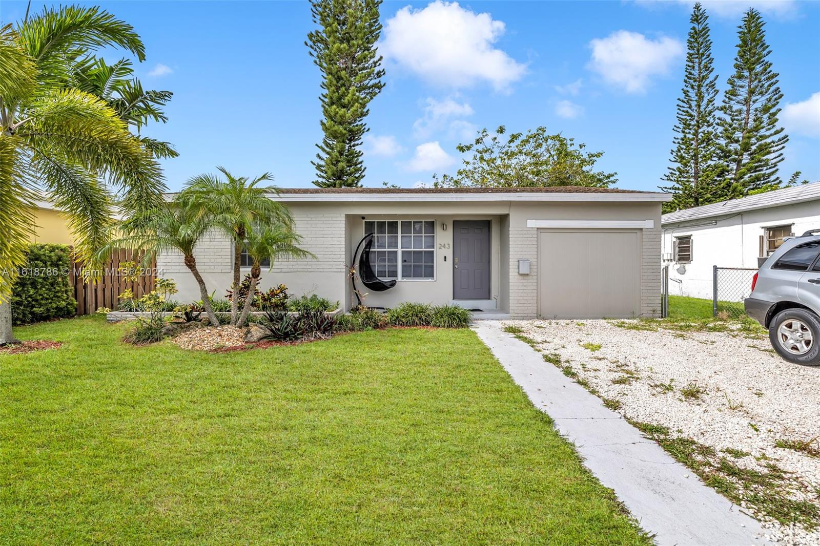 243 Southwest 9th Street Dania Beach, FL 33004 - Photo 8 of 31 a front view of house with yard and outdoor seating