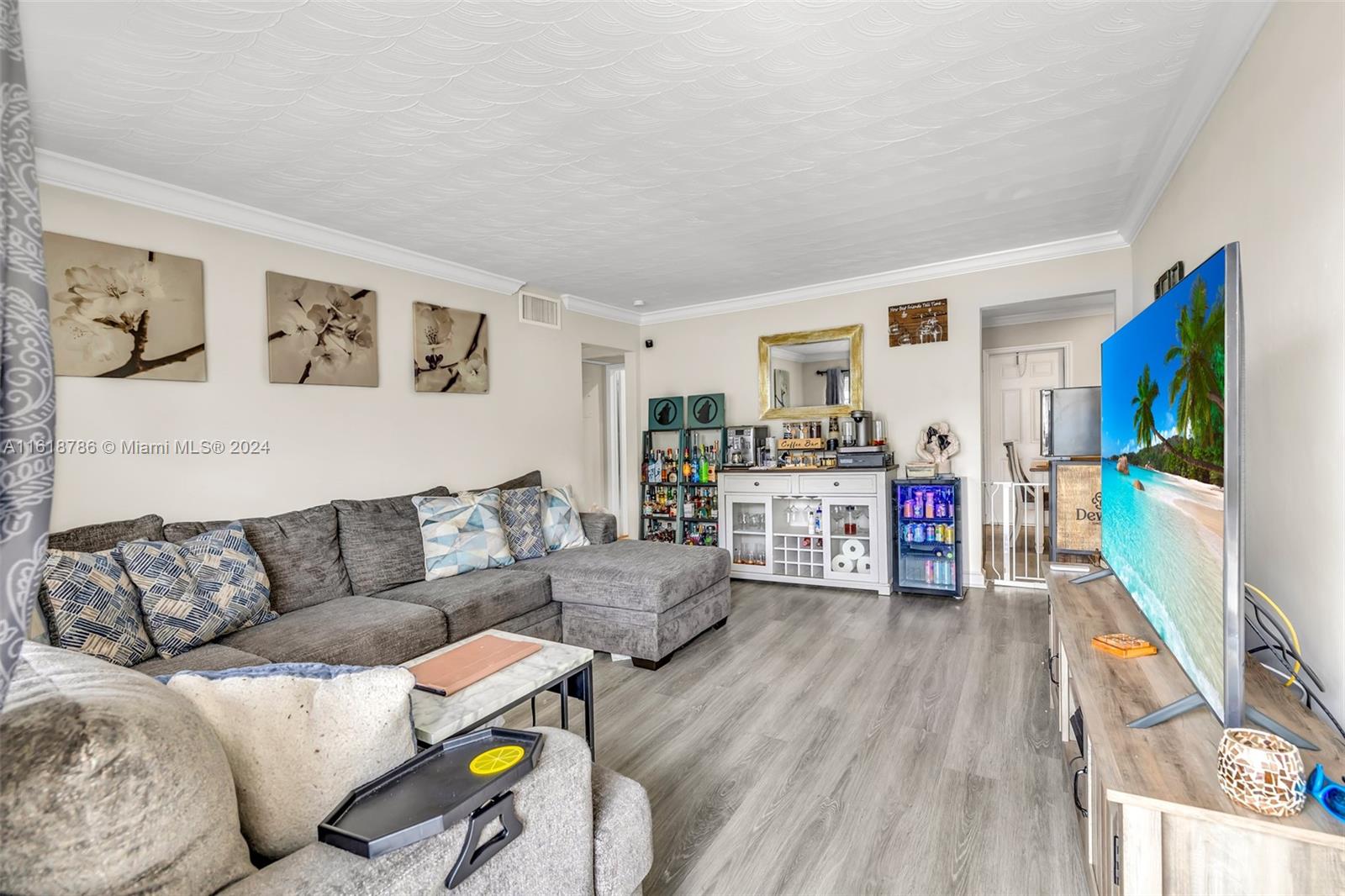 243 Southwest 9th Street Dania Beach, FL 33004 - Photo 10 of 31 a living room with furniture and wooden floor