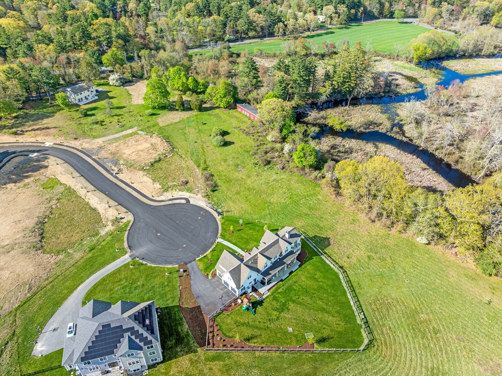 8 Pearl Way Topsfield, MA 01983 - Photo 3 of 9 an aerial view of a house with a yard and lake view