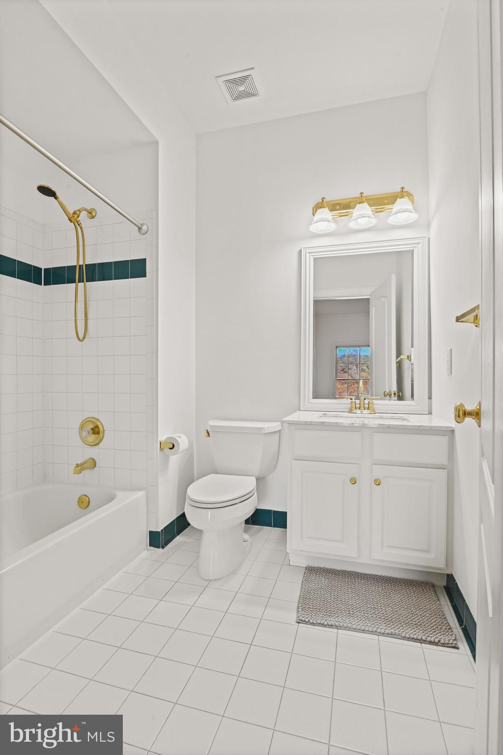 2628 Five Oaks Road Vienna, VA 22181 - Photo 17 of 29 a bathroom with a sink mirror vanity and toilet