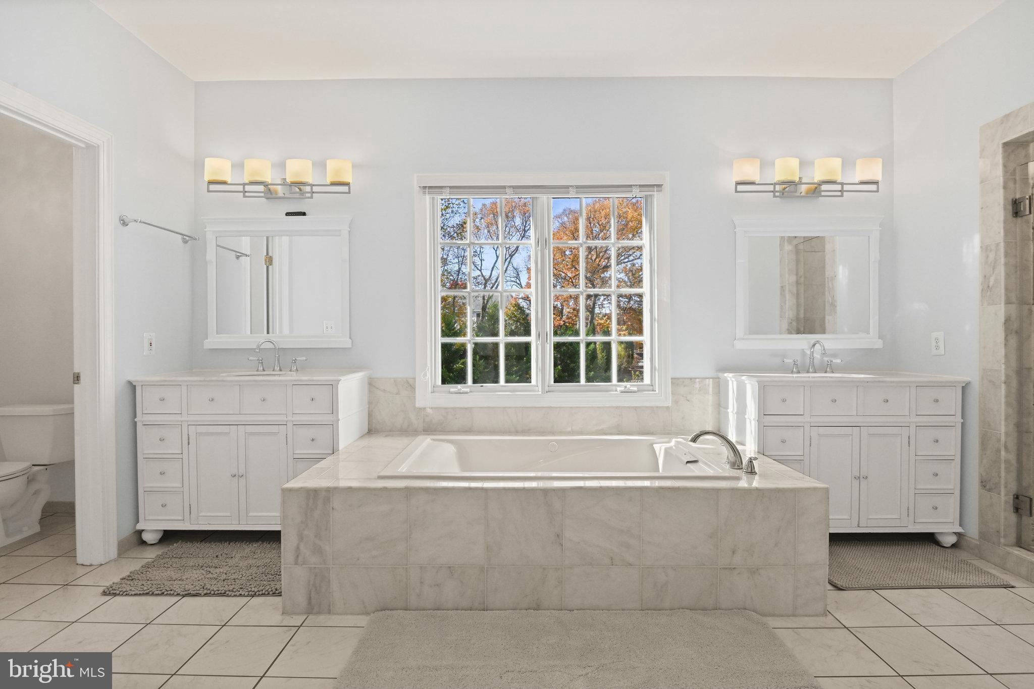 2628 Five Oaks Road Vienna, VA 22181 - Photo 19 of 29 a spacious bathroom with a bathtub and a sink