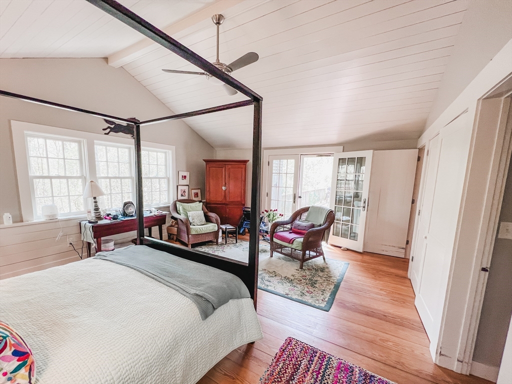 225 Lamberts Cove Road West Tisbury, MA 02568 - Photo 15 of 33 a bedroom with furniture and a window
