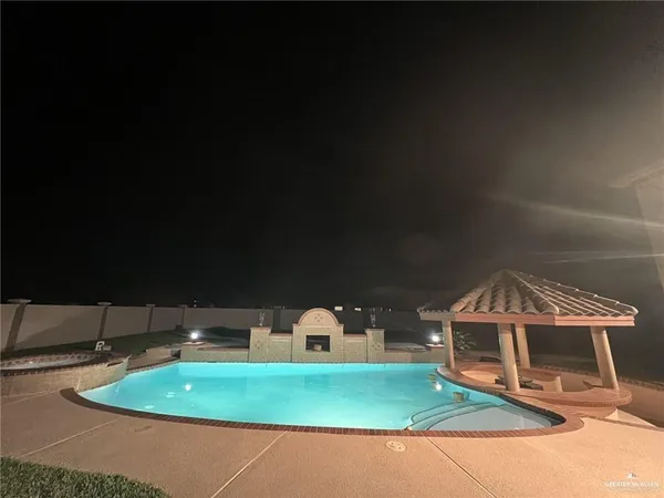 a view of house with swimming pool