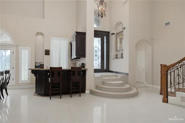 a view of hall way with furniture