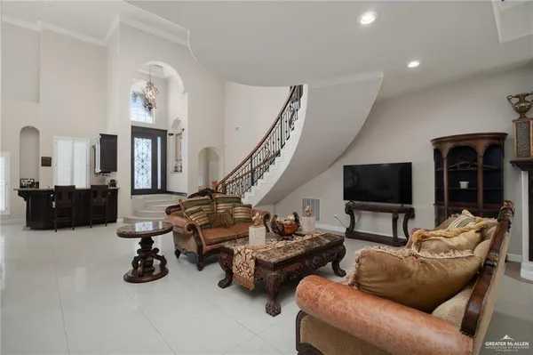 a living room with furniture gym equipment and a flat screen tv