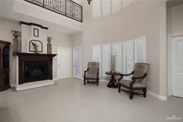 a large kitchen with a table and chairs