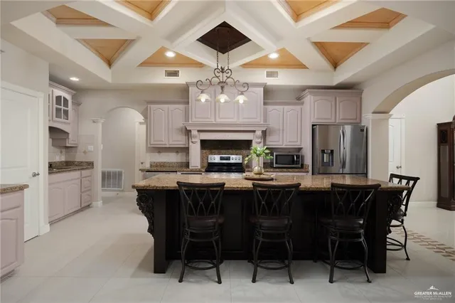 a kitchen with granite countertop a sink and stove
