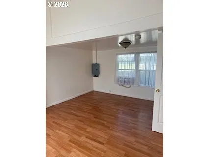a view of walk in closet with wooden floor