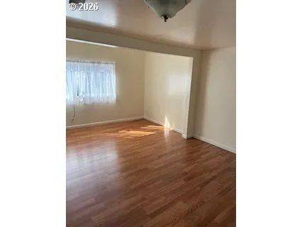 a view of a livingroom with wooden floor