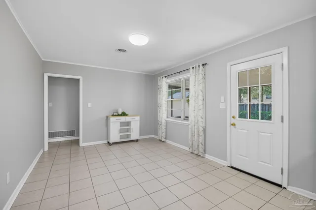 a living room with furniture and a garden