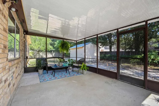 a view of a chairs and table in patio