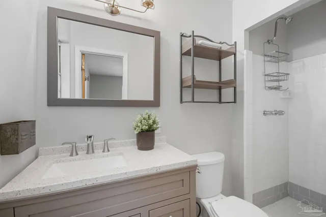 a bedroom with a bed and a night stand