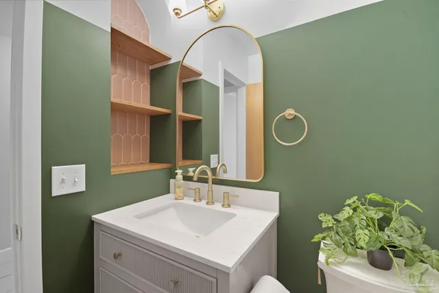 a bathroom with a sink and a mirror