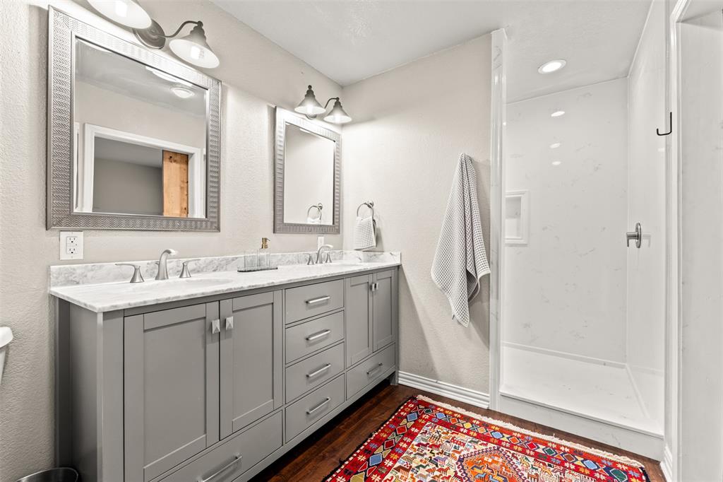 3116 Alexander Avenue Waco, TX 76708 - Photo 21 of 40 a bathroom with a double vanity sink mirror and shower