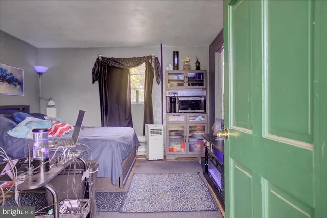 a bathroom with a sink mirror vanity and toilet