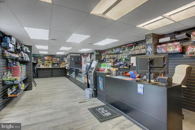 a room with lots of wooden furniture and a window