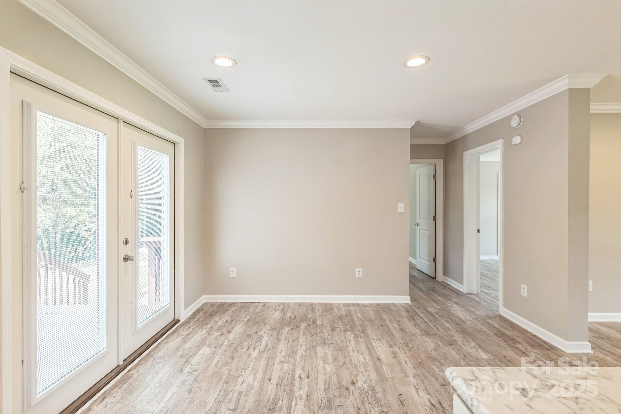 1259 Hardin Road Dallas, NC 28034 - Photo 15 of 16 a view of empty room with wooden floor and fan